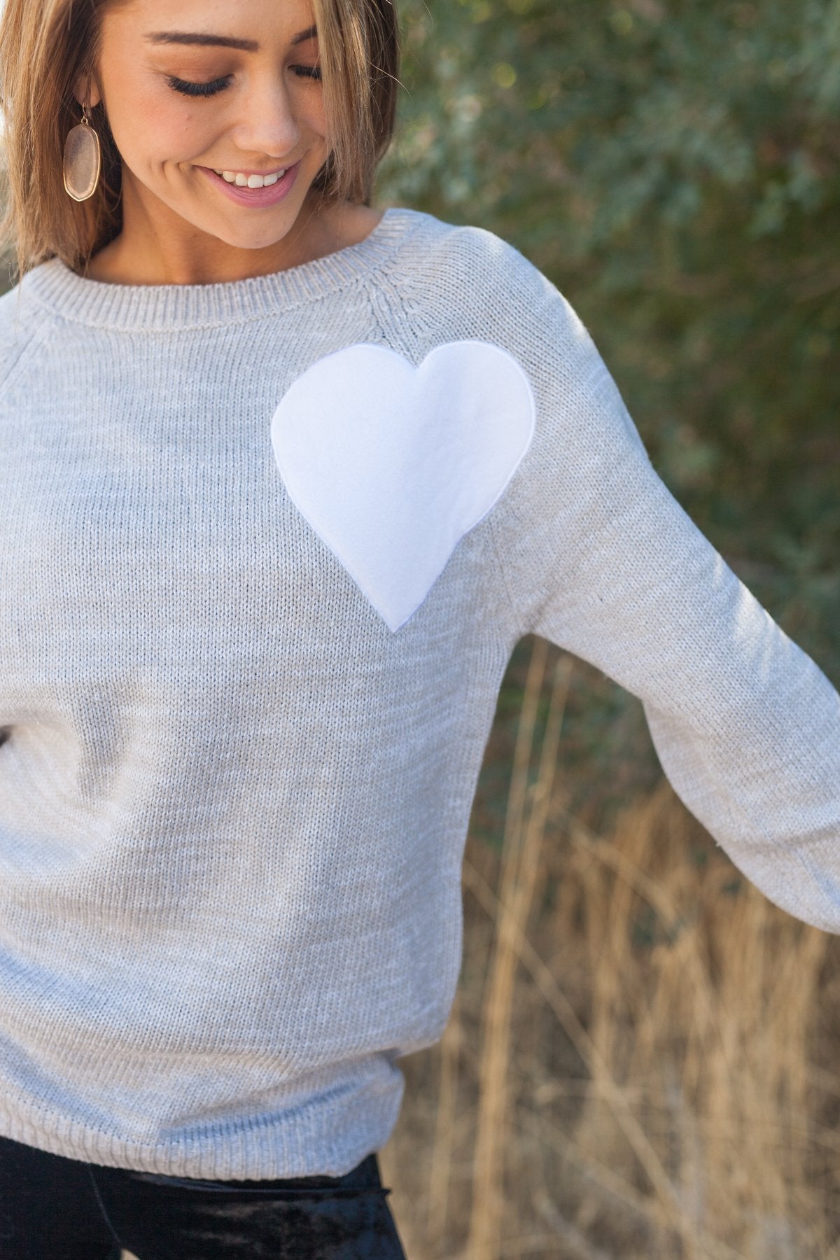 Wear Your Heart On Your Sleeve Sweater In Gray